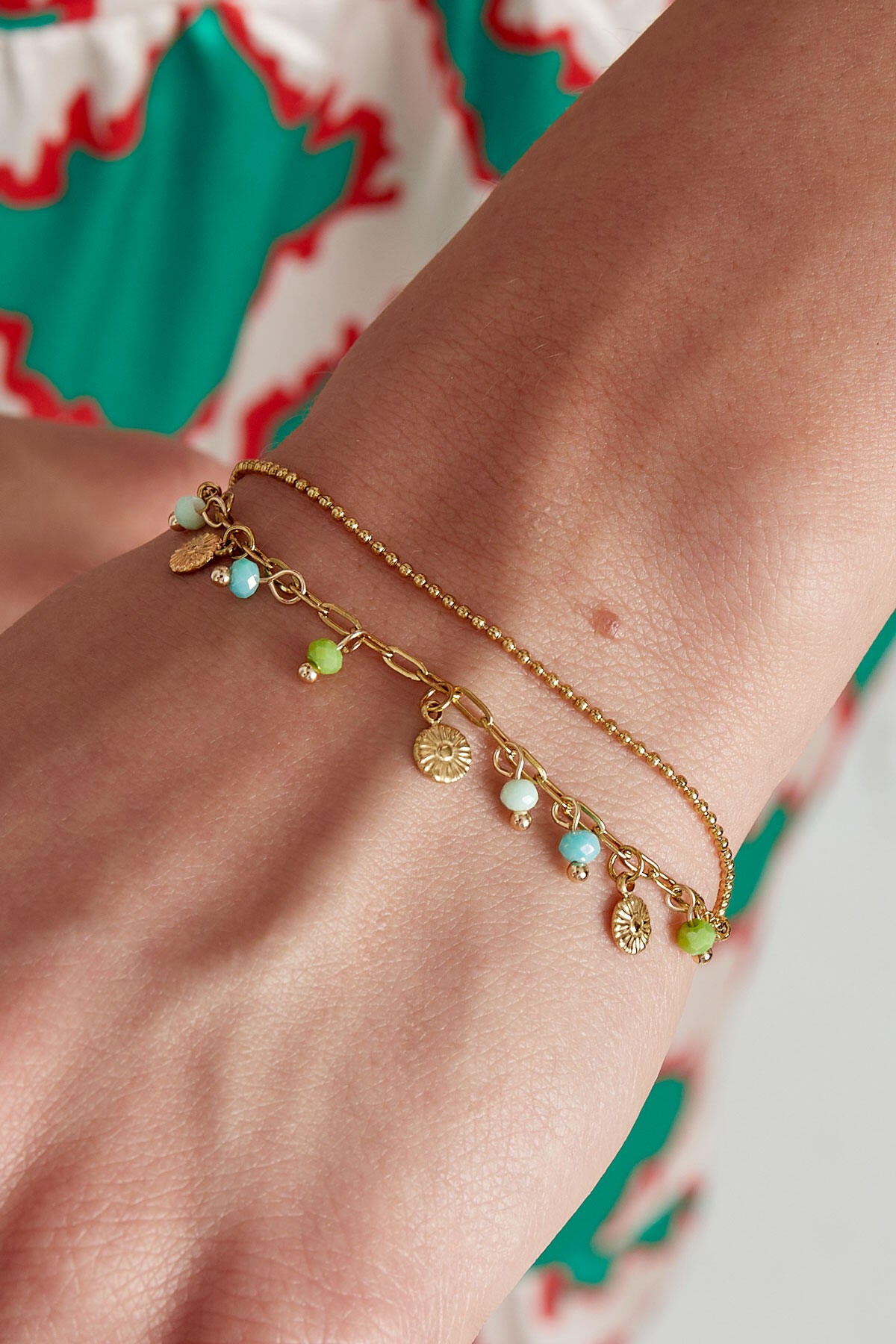 Armband met muntjes en kralen - roze/Goud kleur 