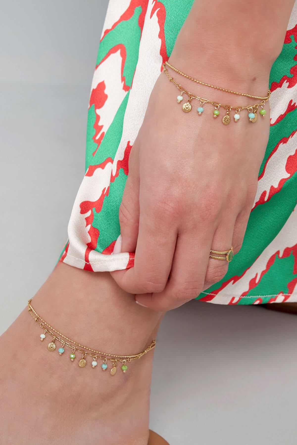 Armband met muntjes en kralen - roze/Goud kleur 